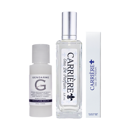 Carriere travel set, includes 2oz Gendarme Moisture Balm, 2oz Carriere Eau De Parfum glass spray bottle, and .27 oz carriers travel size spray in box on a white background.