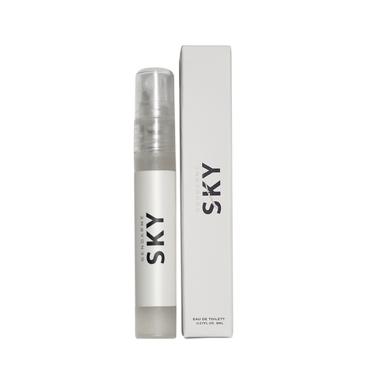 Gendarme Sky Eau De Toilette travel spray bottle next to its packaging box, both featuring the label 'SKY'.