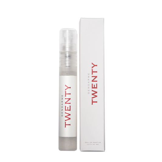 Gendarme 20 Eau De Parfum travel spray bottle alongside its packaging box. The bottle is clear with a white spray nozzle and the brand name is written in red.