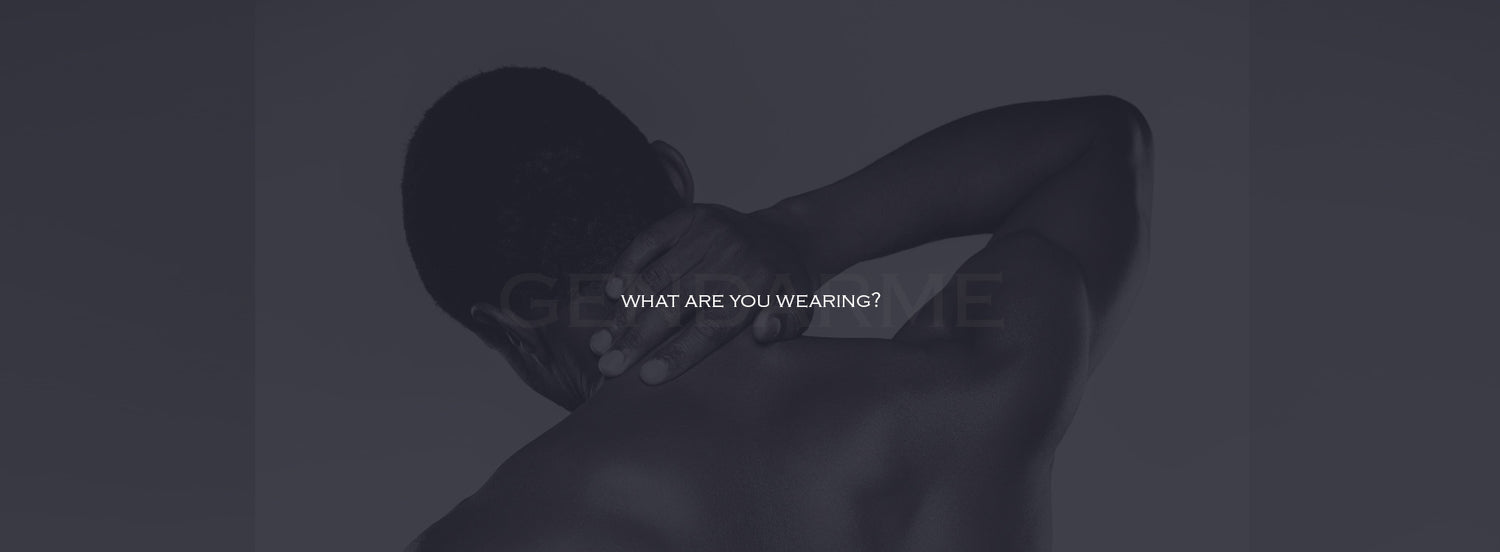 Person lying on a black surface with 'What Are You Wearing?' text overlay-Home Page