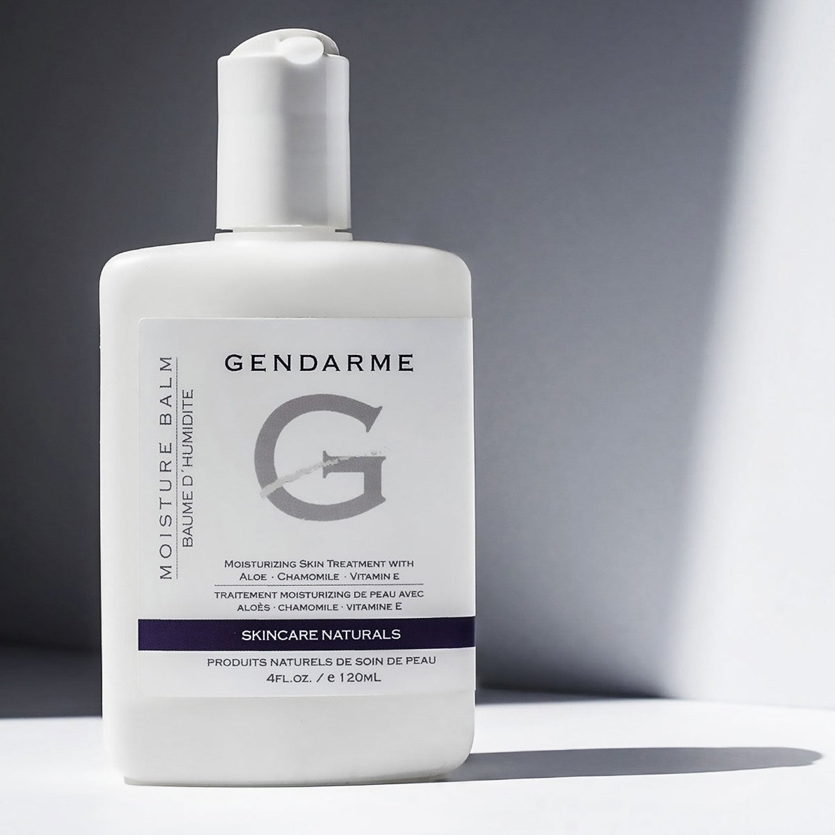 Styled image of Moisture Balm product  on grey background