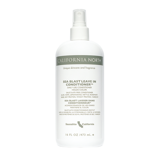 A bottle of California North Sea Blast Leave-In Conditioner with a white spray nozzle. The label displays the brand name, product name, and additional information.
